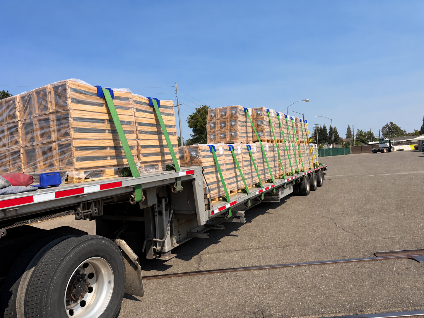 Crated freight secured on a full-size step-deck trailer